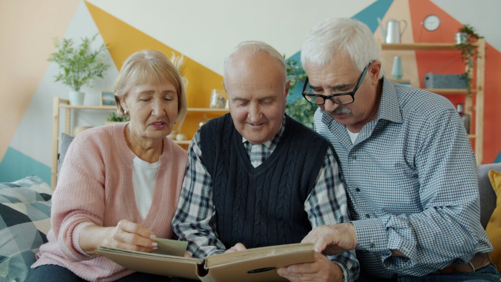 Adult children and parent discussing life insurance decisions together